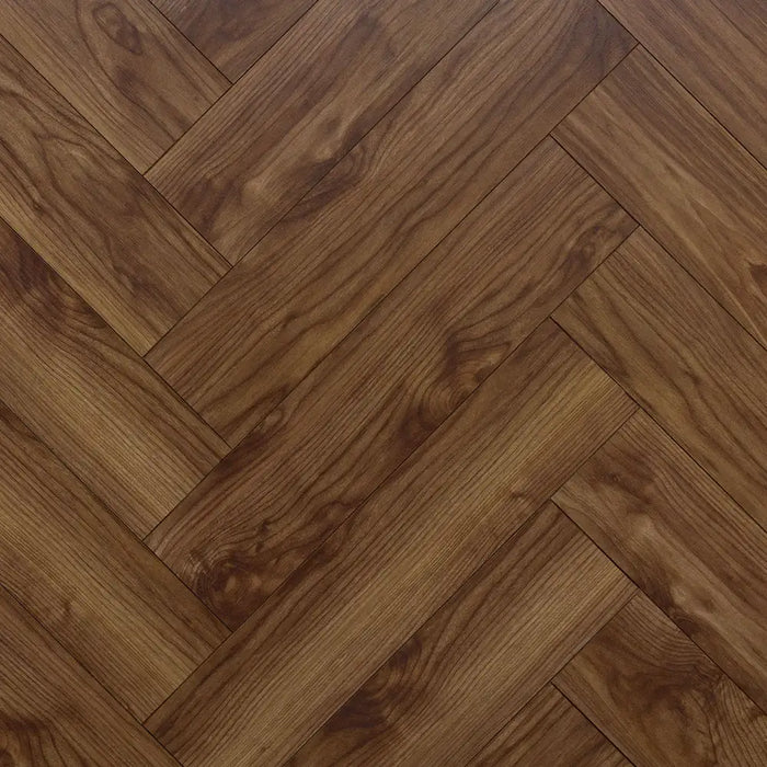 Close-up herringbone pattern detail of Glasgow 12mm walnut laminate flooring