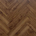 Close-up herringbone pattern detail of Glasgow 12mm walnut laminate flooring