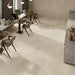 Homeful Essentials Cream Matt 75x75 porcelain floor tiles in a contemporary café interior