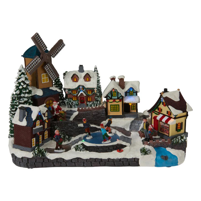 Snowy village scene with a windmill and ice rink, shown unlit