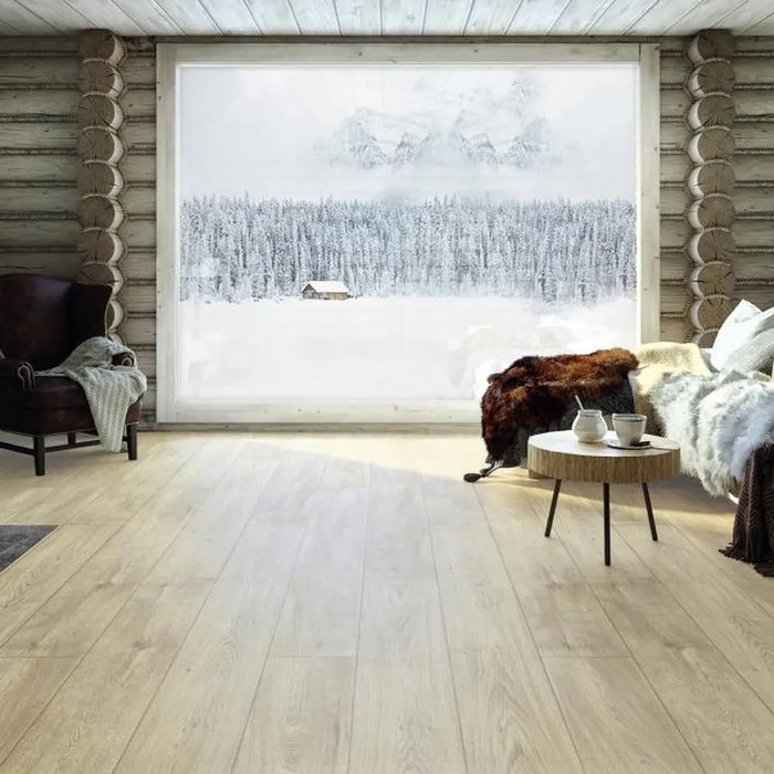 Krono Galaxy Oak long plank laminate flooring in a cosy cabin-style living room