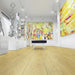 Krono Lark Oak long plank laminate flooring in a bright gallery-style room
