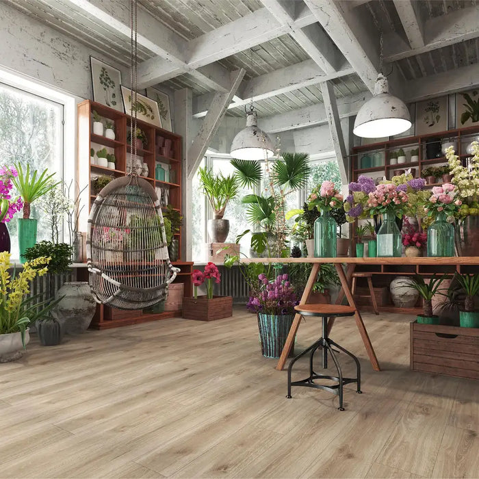Krono Venice Oak long plank laminate flooring in a plant-filled florist studio setting