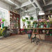 Krono Venice Oak long plank laminate flooring in a plant-filled florist studio setting