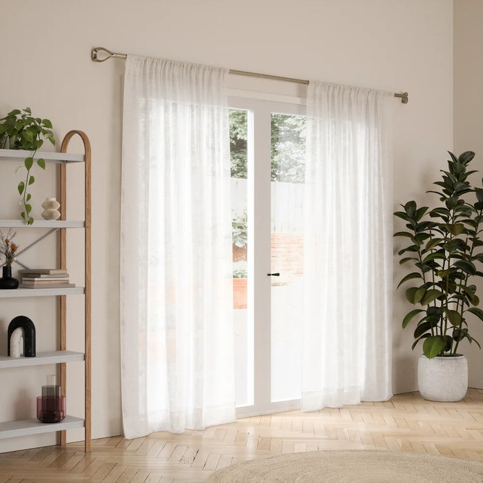 Loop nickel curtain pole with curtain in a living room setting