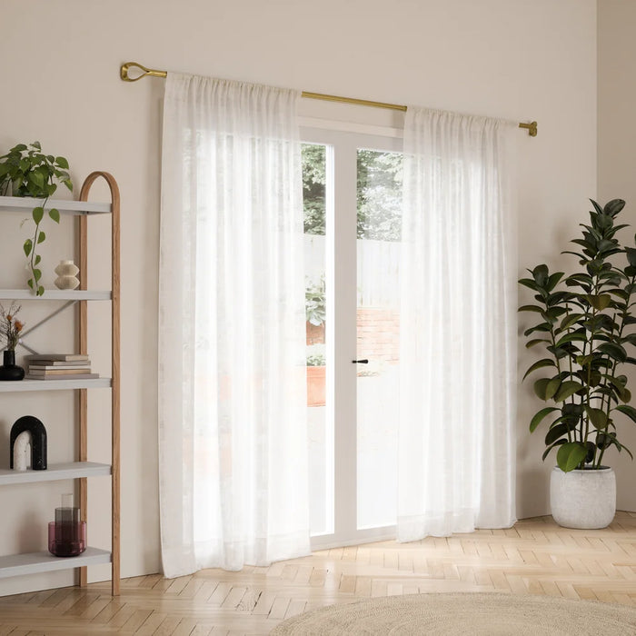 Loop gold curtain pole with curtain in a living room setting