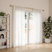 Loop gold curtain pole with curtain in a living room setting
