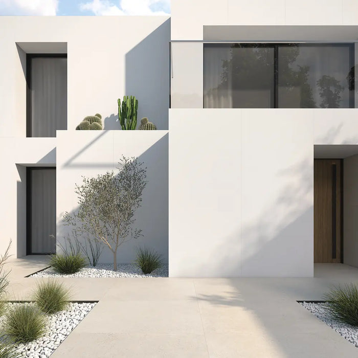 Memory Marfil porcelain tile used as exterior paving outside a modern house