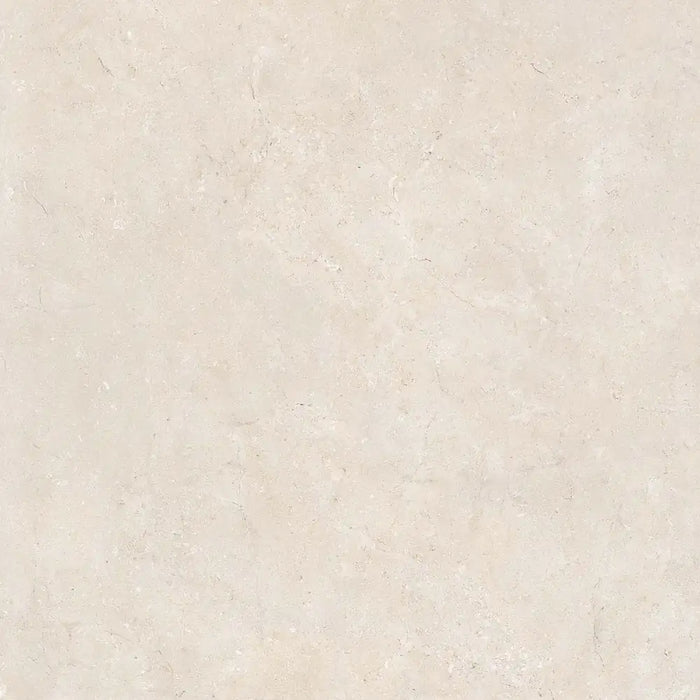 Close-up matt finish surface detail of Montpellier Marfil porcelain tile