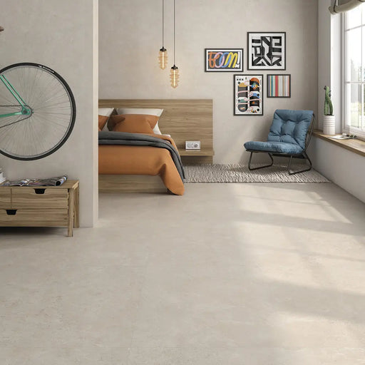 Montpellier Marfil porcelain tile floor in a bedroom setting