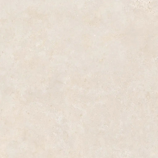 Close-up limestone-effect surface detail of Montpellier Marfil porcelain tile