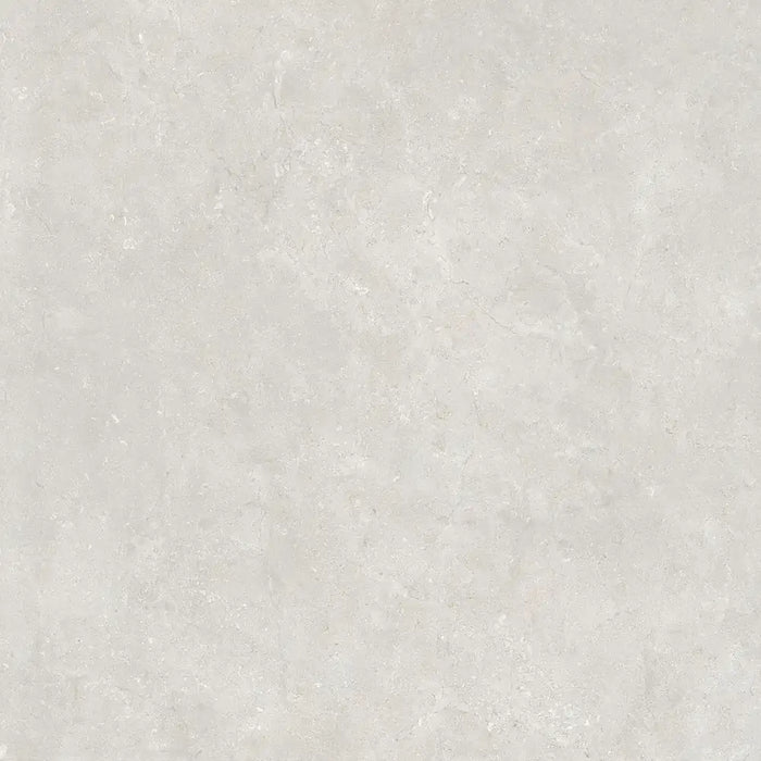 Close-up natural stone texture detail of Montpellier Perla porcelain tile