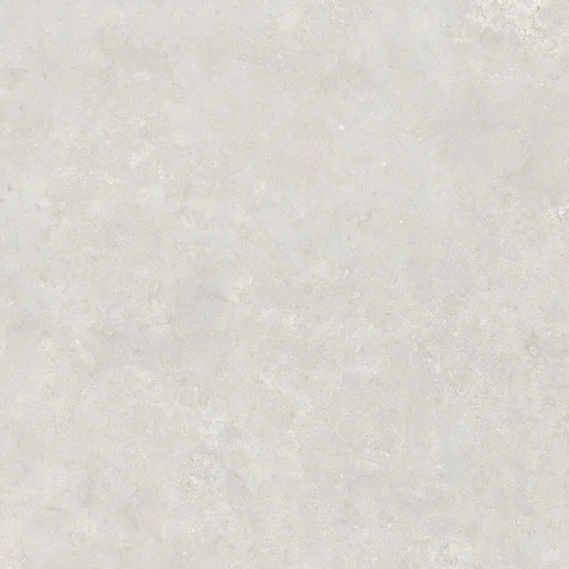 Close-up limestone-effect surface detail of Montpellier Perla porcelain tile