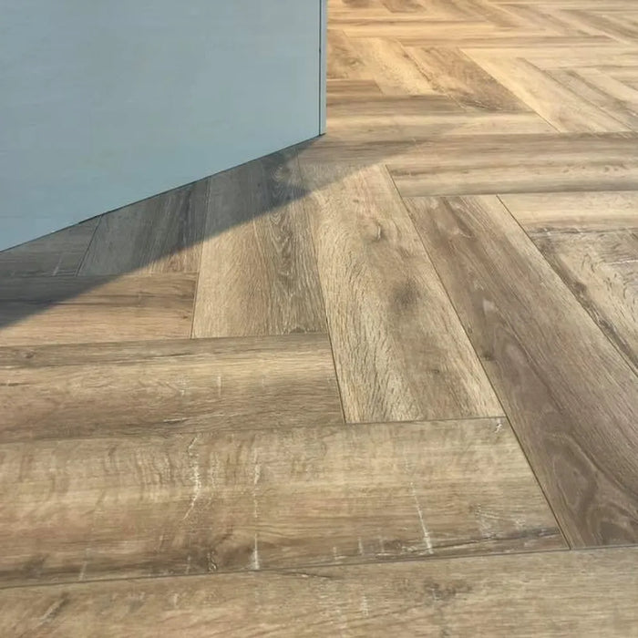 Nottingham herringbone laminate flooring installed in a sunlit room