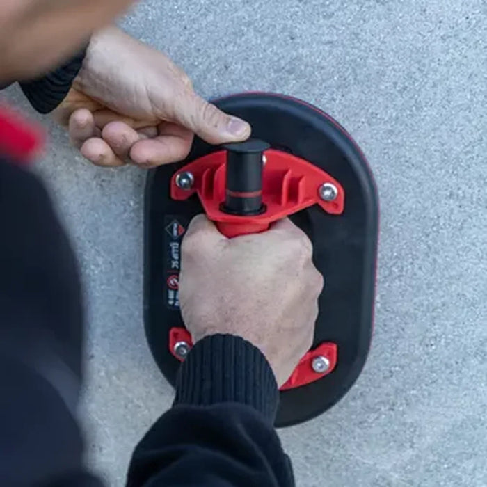 Close-up of hands operating the Rubi Ellip suction cup handle"