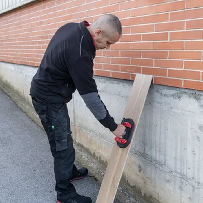 Rubi Ellip suction cup in use lifting a timber plank