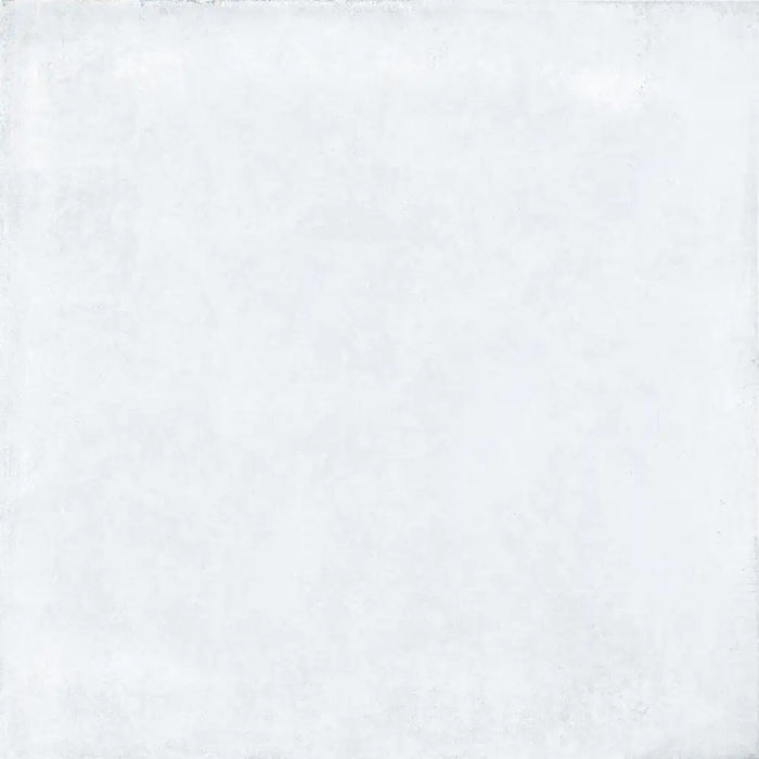 Close-up concrete-effect surface detail of Rue De Paris Blanco porcelain tile