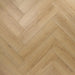 Close-up herringbone pattern detail of Shannon 12mm laminate flooring