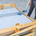 Sigma Ergo-Lift 1E lifting a tile out of a wooden crate