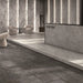Modern commercial interior featuring Syrah Light Matt Porcelain 60x60 marble-effect floor tiles in a reception area
