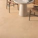 Terracota Paja porcelain tile floor in a dining room setting