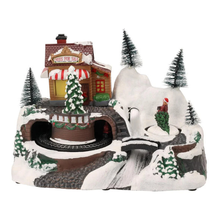 Snowy hillside Christmas scene with a striped-awning tree shop, tunnels, a bridge and bottle brush trees