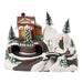 Snowy hillside Christmas scene with a striped-awning tree shop, tunnels, a bridge and bottle brush trees