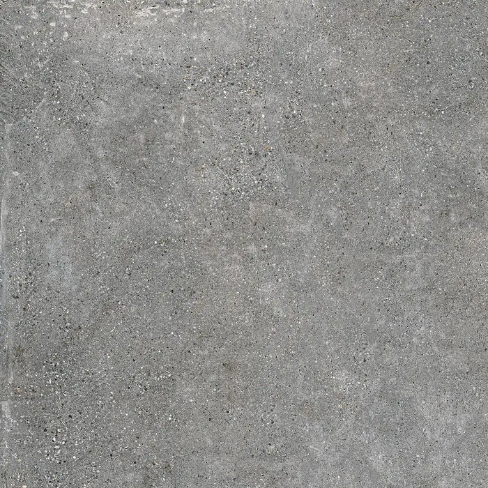 Close-up aggregate texture detail of Underground Graphite porcelain tile