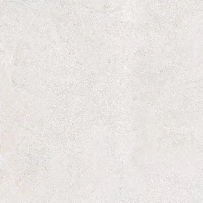 Close-up concrete-effect surface detail of Verse Cream porcelain tile
