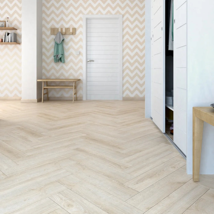 Vicence herringbone laminate flooring in a hallway with chevron wallpaper
