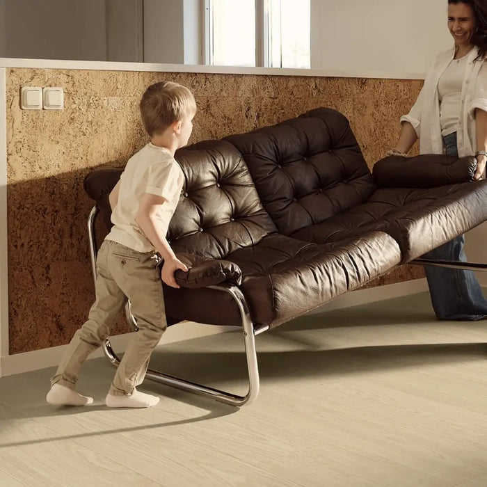 Pergo Visby Midsummer Light laminate flooring in a living room with sofa