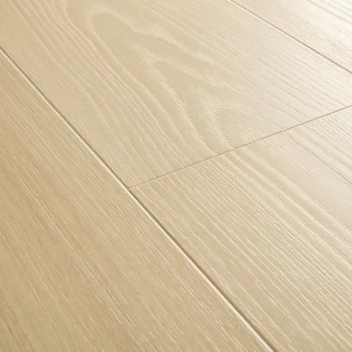 Angled close-up of Pergo Visby Midsummer Light oak laminate flooring grain and bevel