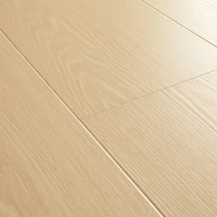 Angled close-up of Pergo Visby Sunwash oak laminate flooring grain and bevel