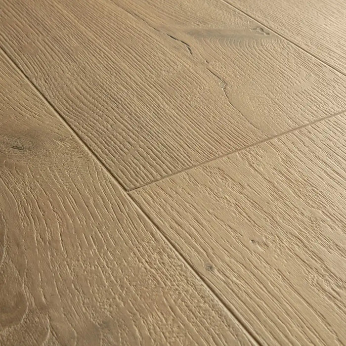 Angled close-up of Pergo Visby Driftwood Brown oak laminate flooring grain and bevel