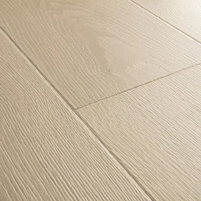 Angled close-up of Pergo Visby Light Grey oak laminate flooring grain and bevel
