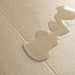 Water droplets beading on Pergo Visby Light Grey laminate flooring surface