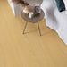 Pergo Visby Amberlight laminate flooring in a bedroom setting with side table