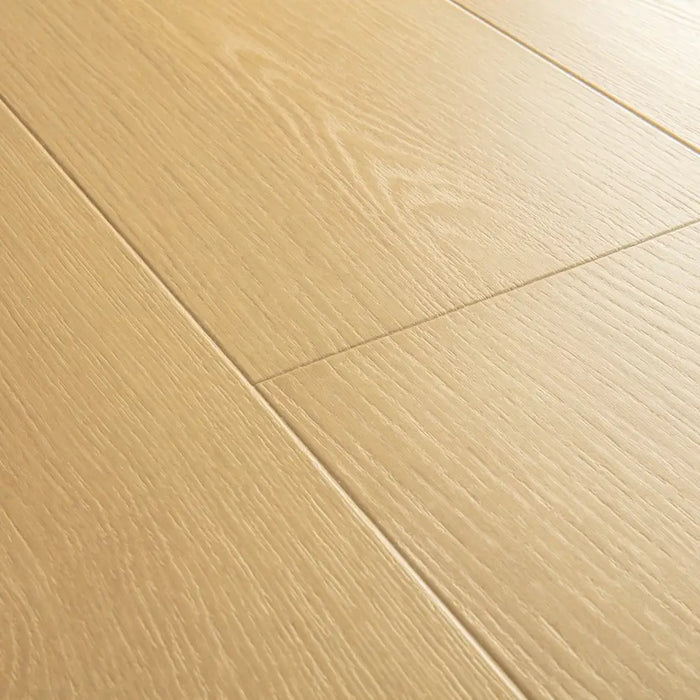 Angled close-up of Pergo Visby Amberlight oak laminate flooring grain and bevel
