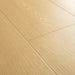 Angled close-up of Pergo Visby Amberlight oak laminate flooring grain and bevel