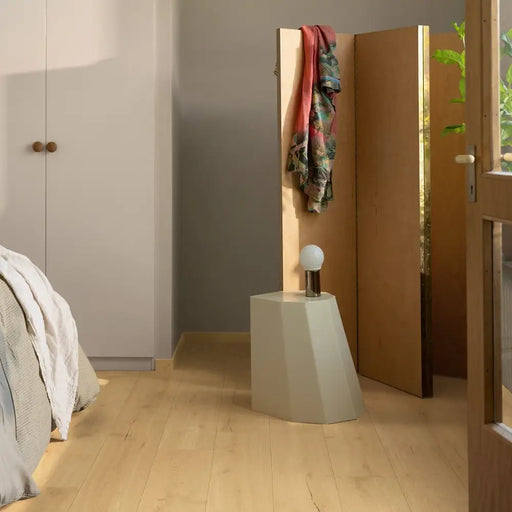 Pergo Visby Smokewood laminate flooring in a bedroom setting