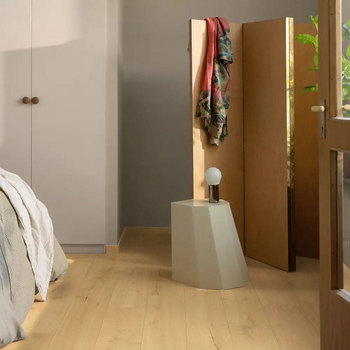 Pergo Visby Smokewood laminate flooring in a bedroom setting