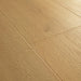 Angled close-up of Pergo Visby Smokewood oak laminate flooring grain and bevel