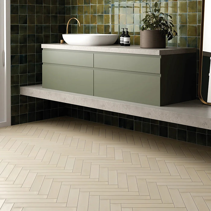 Wadi Beige matt porcelain 6x30 herringbone floor tiles in a contemporary bathroom