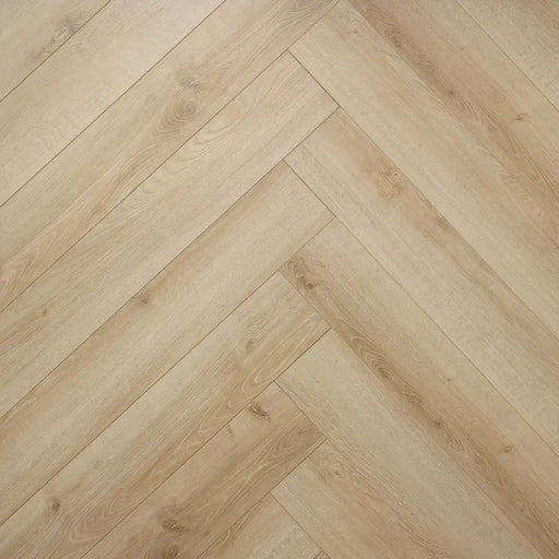 Close-up herringbone pattern detail of Waterford 12mm laminate flooring