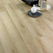 Waterford 12mm laminate flooring styled with a decorative vase and tray