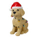Golden yellow dog figure in a Santa hat wrapped in colourful Christmas lights