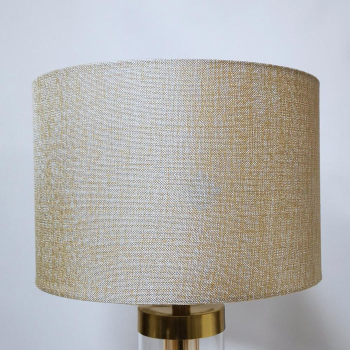 Jane glass cylinder bronze-gold table lamp featuring a square base, a sturdy glass cylinder above and an elegant drum shade in softest gold