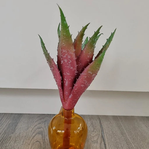 Burgundy and green artificial aloe succulent in a vase