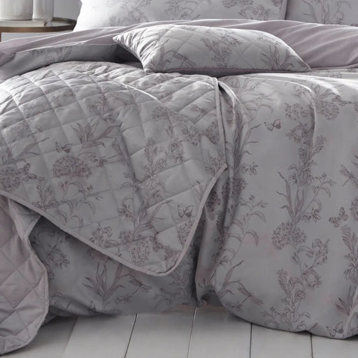 English countryside inspired jacquard Arboretum lilac quilted bedspread with piped edge, beautifully woven blossoms entwined with dragonflies and butterflies