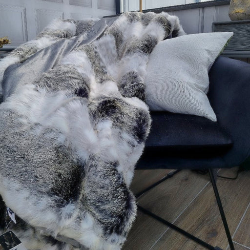 Sumptuous faux Arcticfur throw in a grey/brown pattern, lined with a luxurious satin